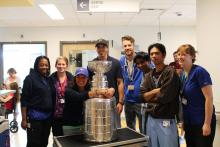 The B08 unit staff with Marc-André Fleury and Lord Stanley's Cup.