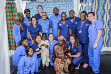 Dr. Sherif Emil, Dr. George Ngock (centre), and the screening team with a patient and his mother.